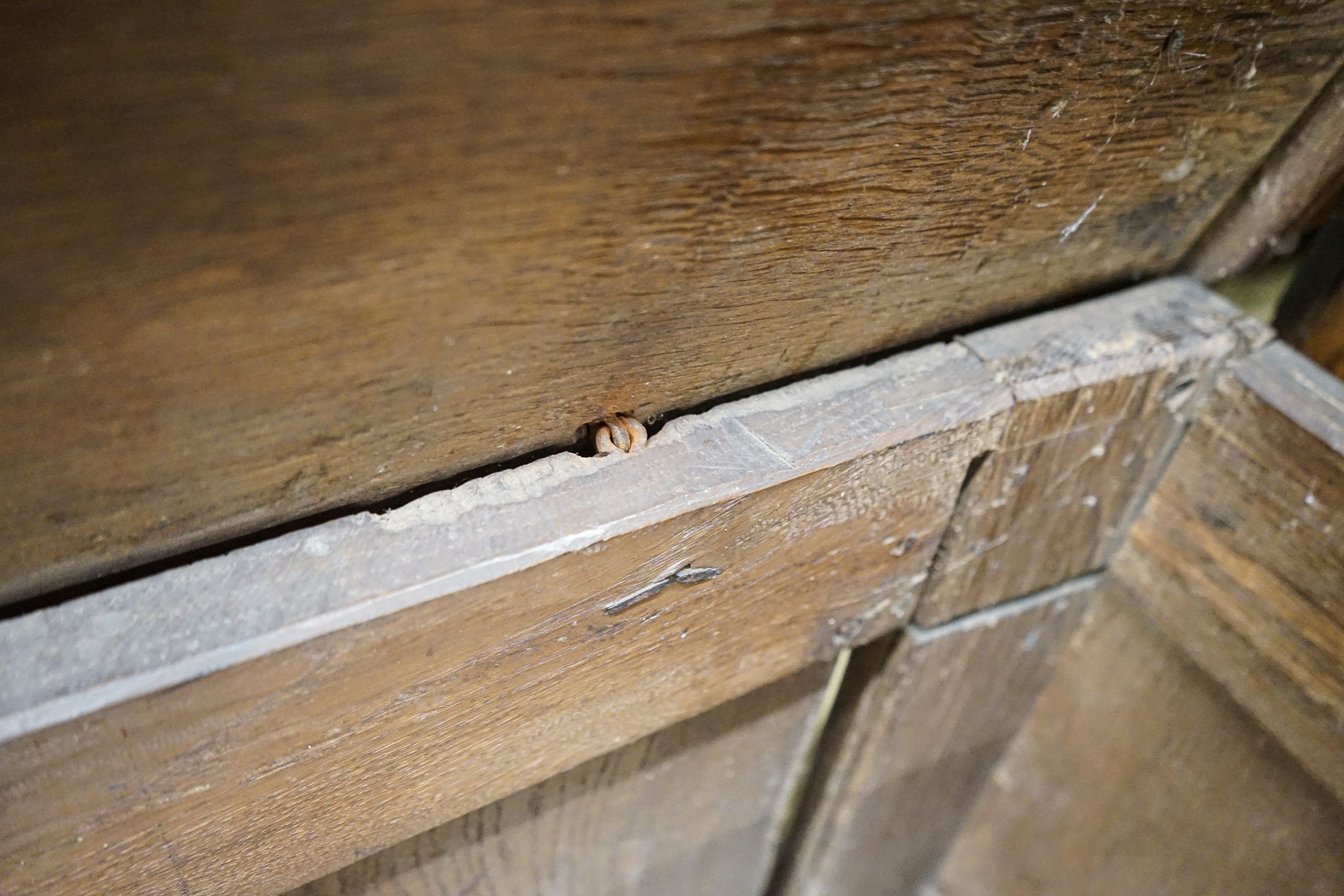 A 17th century oak coffer, with later carved front, length 120cm, depth 56cm, height 69cm